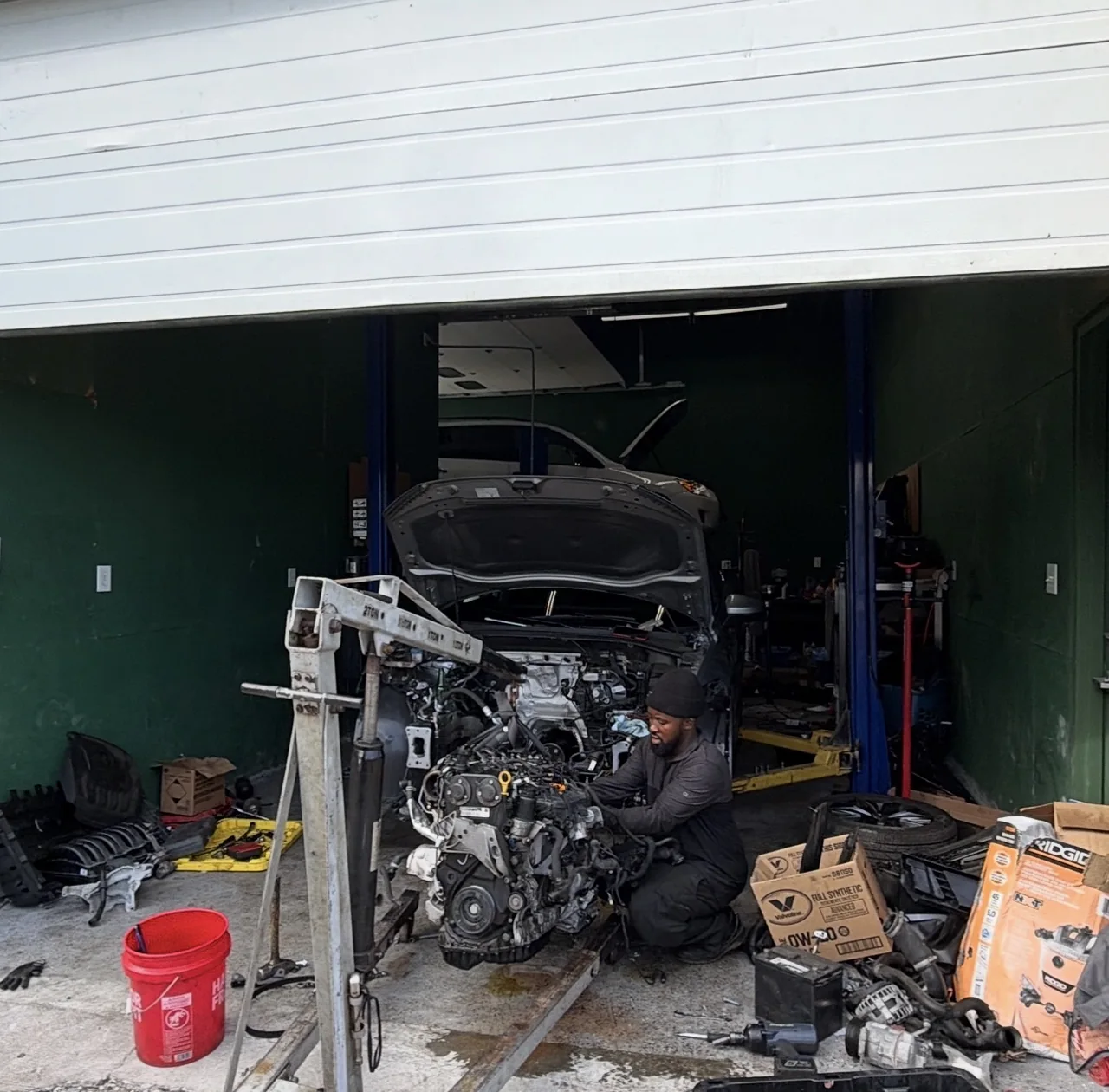 Engine removal work in an M&A service bay
