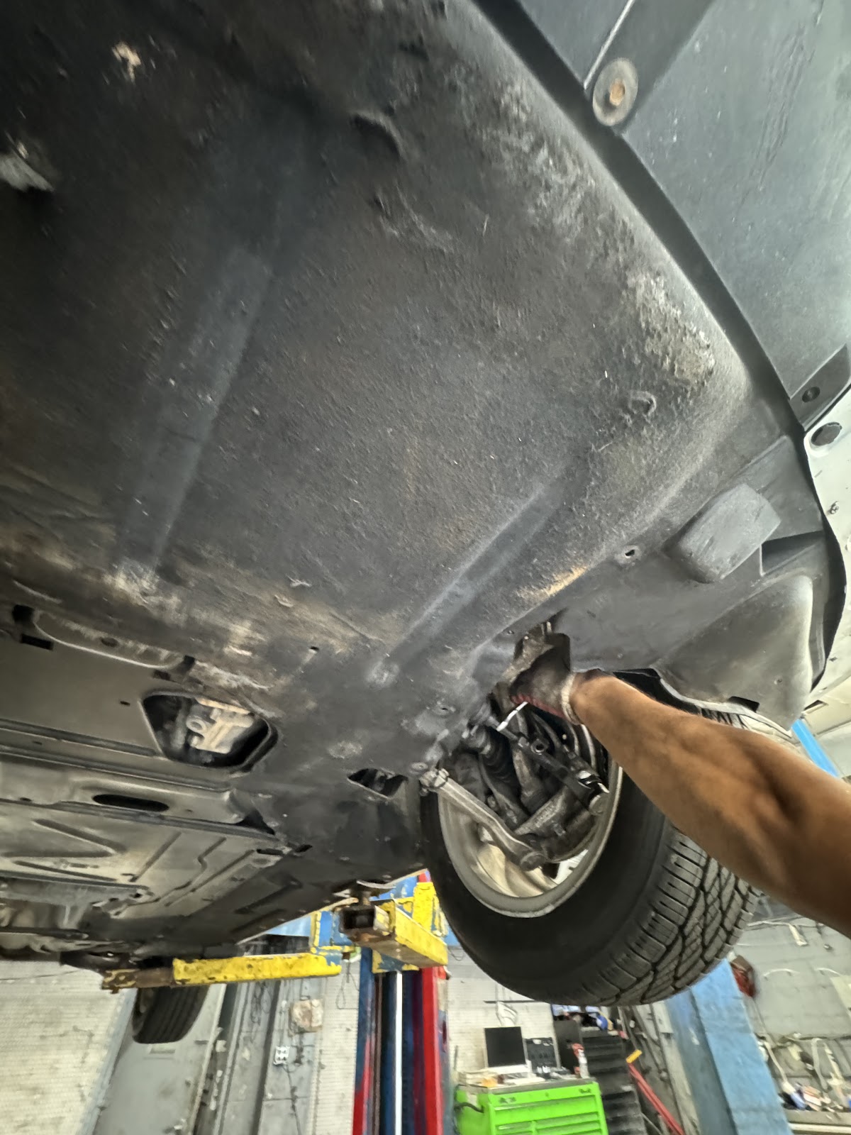 M&A technician inspecting a vehicle